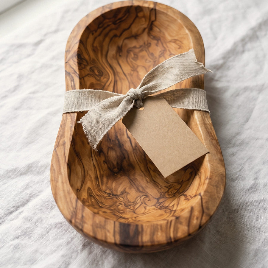 Live edge olive wood bowl wrapped with a linen ribbon and a gift tag