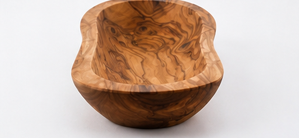 Elongated live edge bowl turned from a single piece of Mediterranean olive wood