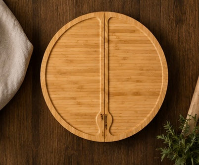 Top view of the round bamboo cheese board with its two swivel halves closed