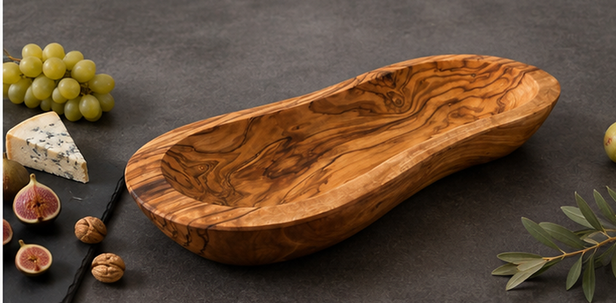 Olive wood bowl turned so the original outline of the wood remains