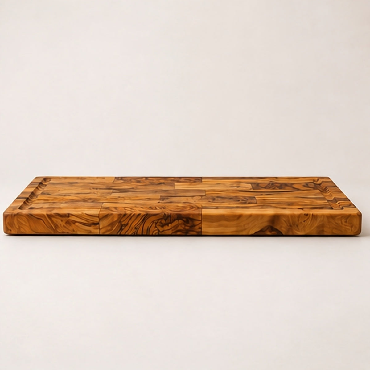 Side view of the olive wood board showing its low profile