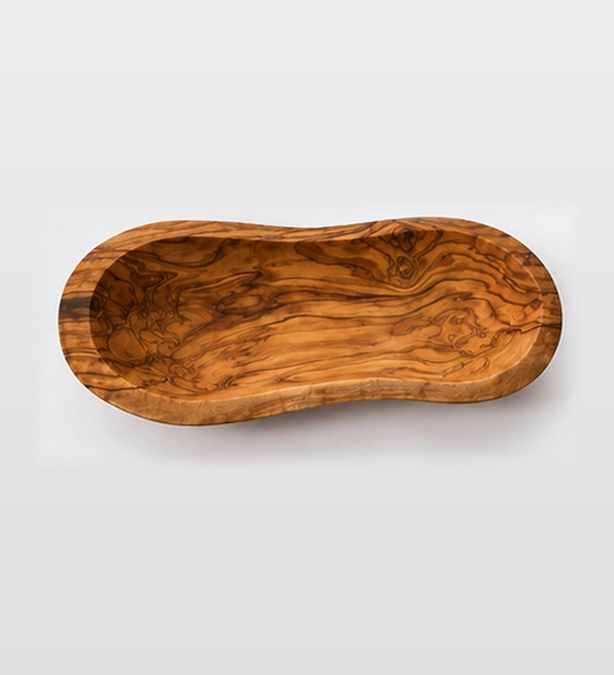 Live edge olive wood bowl seen from above, turned from a single piece of Mediterranean olive wood